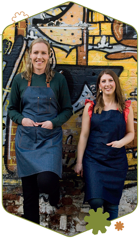 repair-member-us-image-mobile We Are Repairs founders Ally Booker and Gemma Broad leaning against a graffitied wall in central Nottingham.