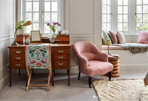 fast-furniture06 A reupholstered armchair back in its new home in a living room setting. Sitting proudly next to a desk in front of a bay window.