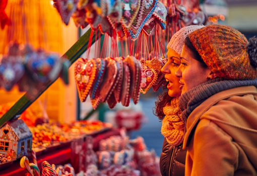 shopping-at-a-small-business Two customers buying Christmas decorations from a small business