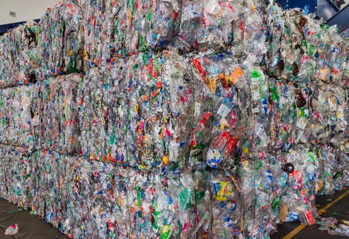 plastic-packaging-in-landfill Plastic packaging being processed